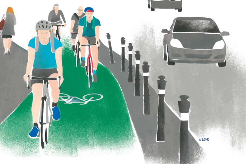 Geschützte Fahrradspur Geschützte Fahrradspur neben Autos